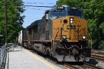 Intermodal cruises east past the platforms